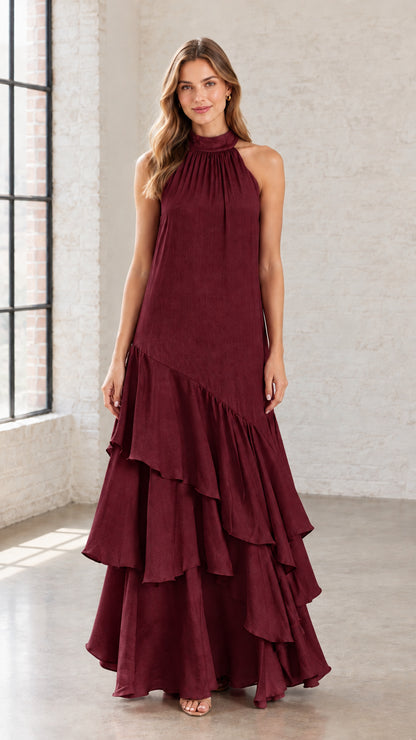 Front view of burgundy halter neck tiered ruffle formal maxi dress