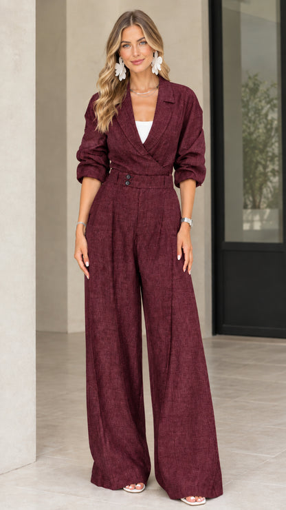 Front view of model wearing burgundy wine lapel collar wide leg jumpsuit