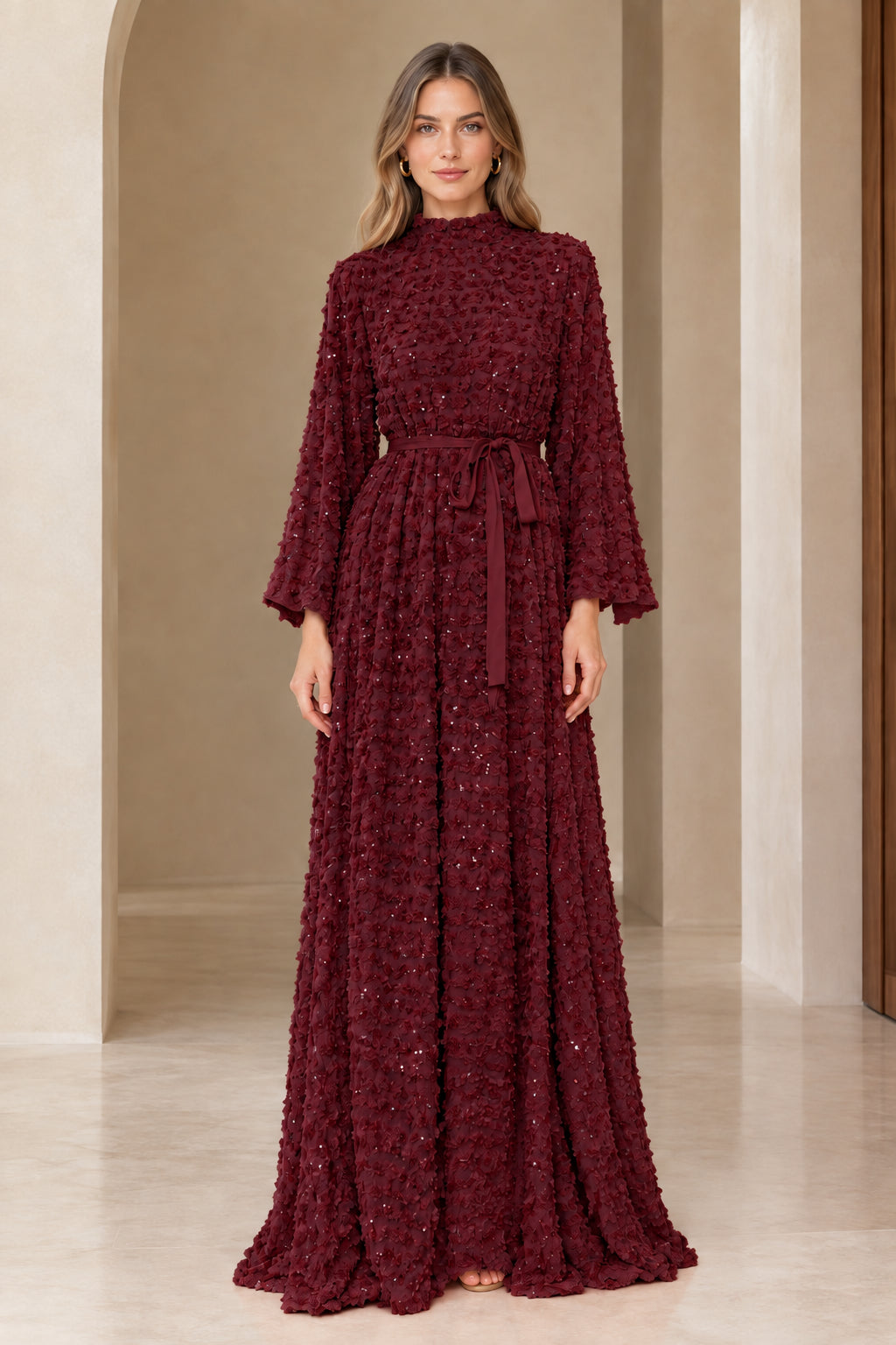 Front full view of burgundy wine textured sequin bell sleeve evening gown