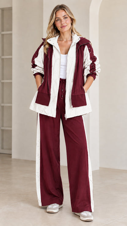 Full front view of burgundy and cream two-piece casual tracksuit set