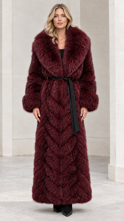 Front view of burgundy red chevron faux fur maxi coat with tie belt
