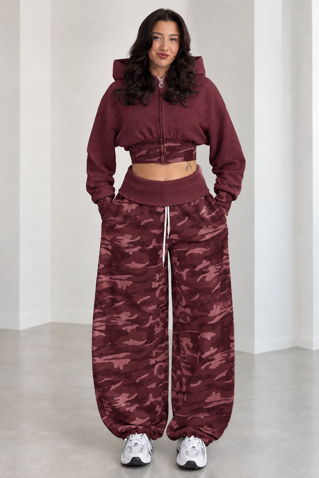 Model wearing Burgundy cropped zip hoodie and maroon camouflage wide-leg sweatpants set