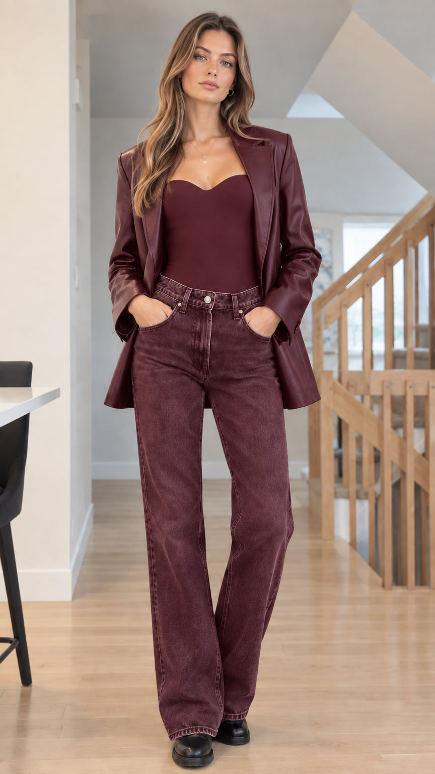 Front view of woman wearing Burgundy faux leather blazer with matching wine red top and trousers