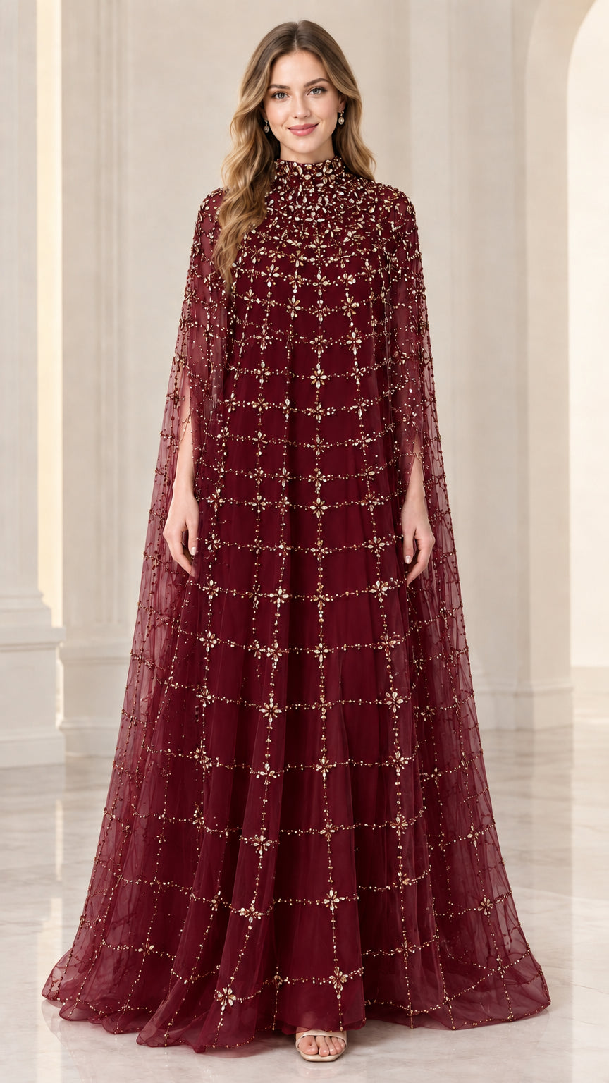 Front full view of woman wearing burgundy wine red beaded cape evening gown