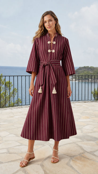 Model wearing burgundy wine striped midi dress with knot button accents