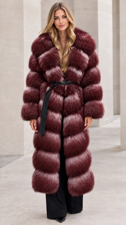 Front full-length view of woman wearing burgundy wine red long tiered faux fur coat with belt