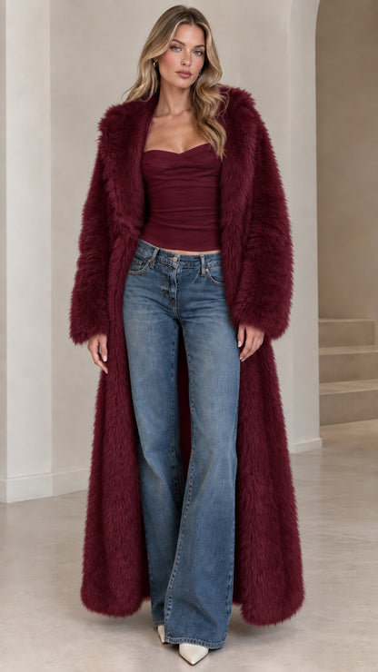 Front view of model wearing deep burgundy floor-length faux fur maxi coat