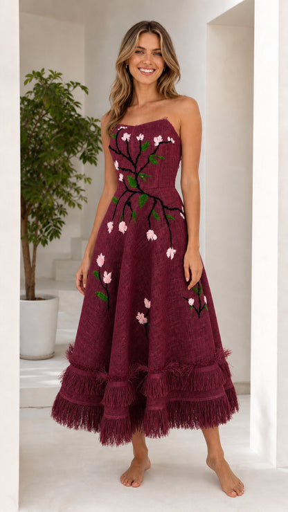 Front view of burgundy floral embroidered strapless midi dress