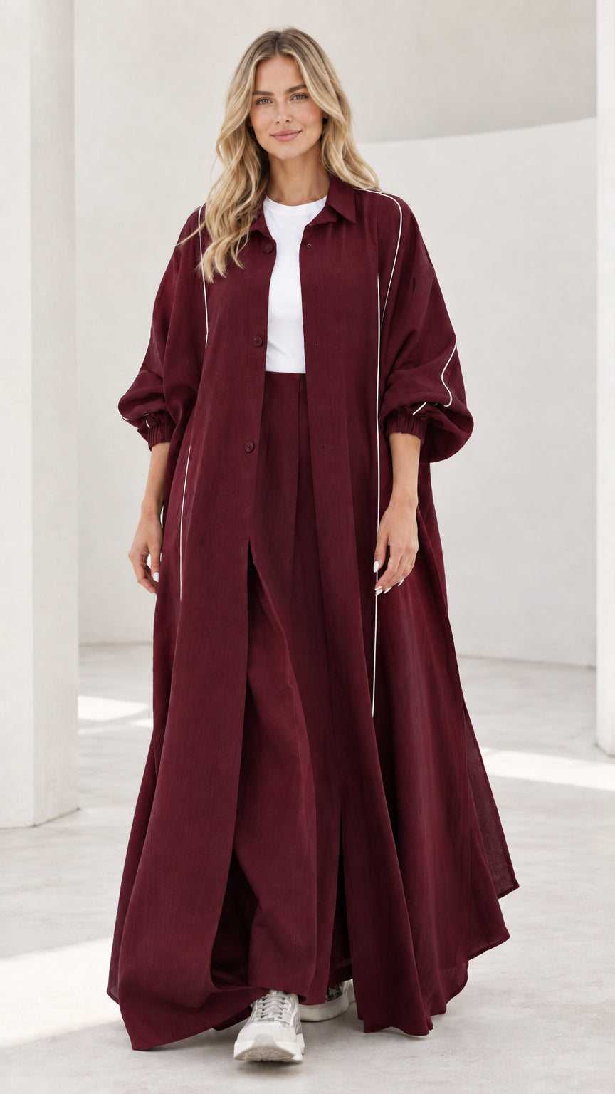 Woman wearing burgundy wine red longline duster and wide leg trousers set