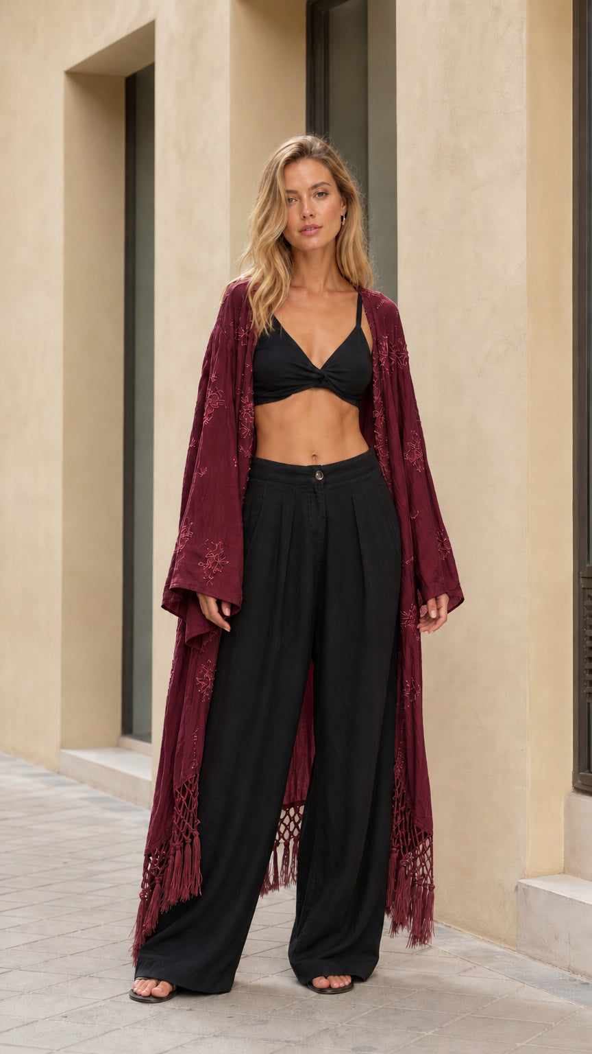 Full front view of woman wearing burgundy wine embroidered open front maxi cardigan
