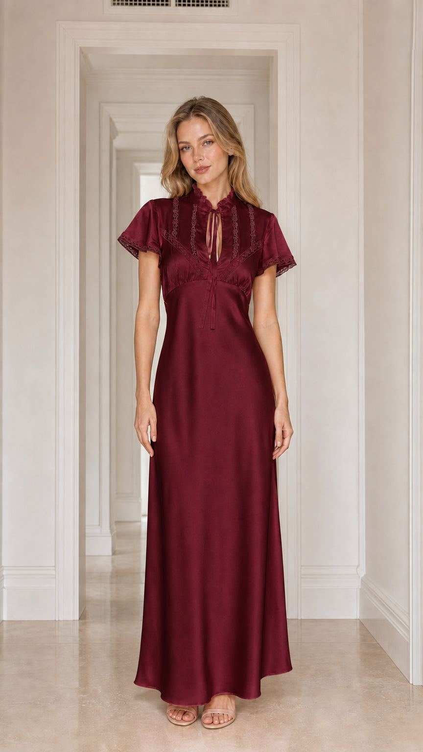 Model wearing burgundy satin lace-trim maxi dress