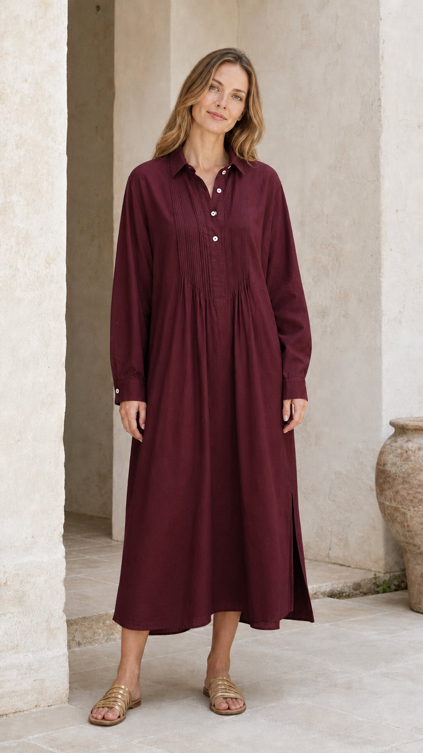 Woman wearing burgundy wine long sleeve pleated midi shirt dress