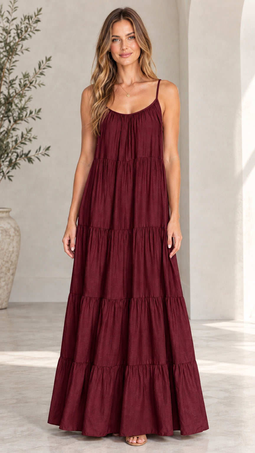 Front view of model wearing burgundy tiered sleeveless maxi dress