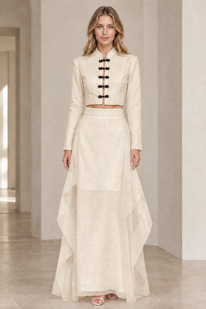 Front view of model wearing beige cream mandarin collar crop top and maxi skirt set