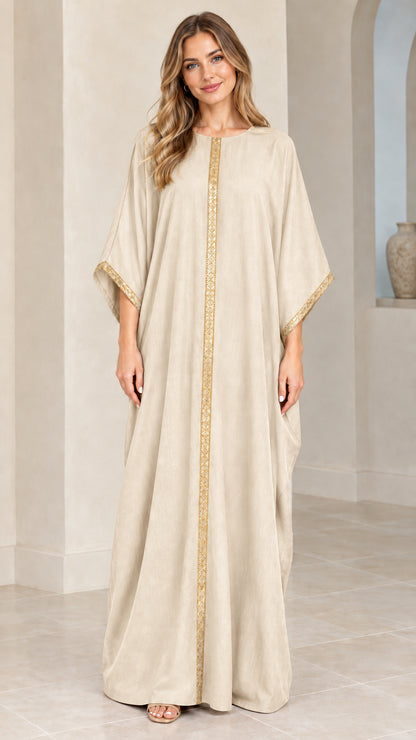Full front view of model wearing beige cream kaftan maxi dress with gold trim