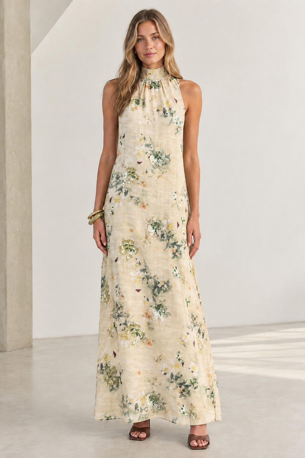 Front view of Cream floral halter neck sleeveless maxi dress