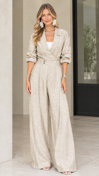 Front view of model wearing beige oatmeal lapel collar wide leg jumpsuit