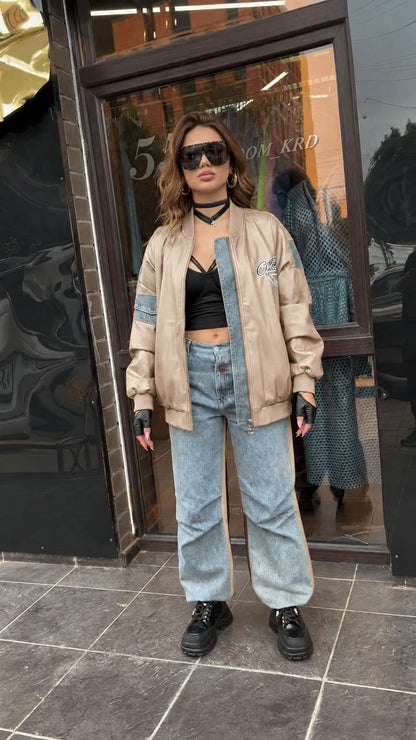 Full-length view of beige faux leather varsity bomber jacket with streetwear styling