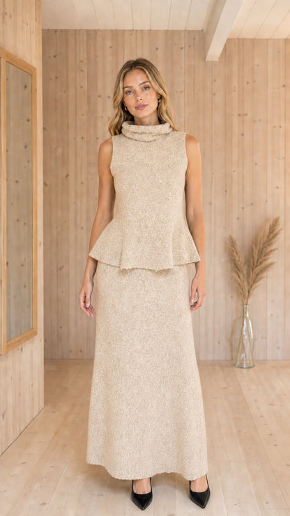 Front view of woman wearing Oatmeal Beige sleeveless peplum top and maxi skirt knit set