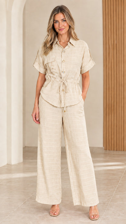 Full front view of model wearing beige textured two-piece matching loungewear set