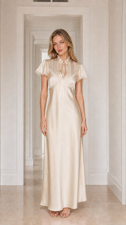 Model wearing champagne satin lace-trim maxi dress