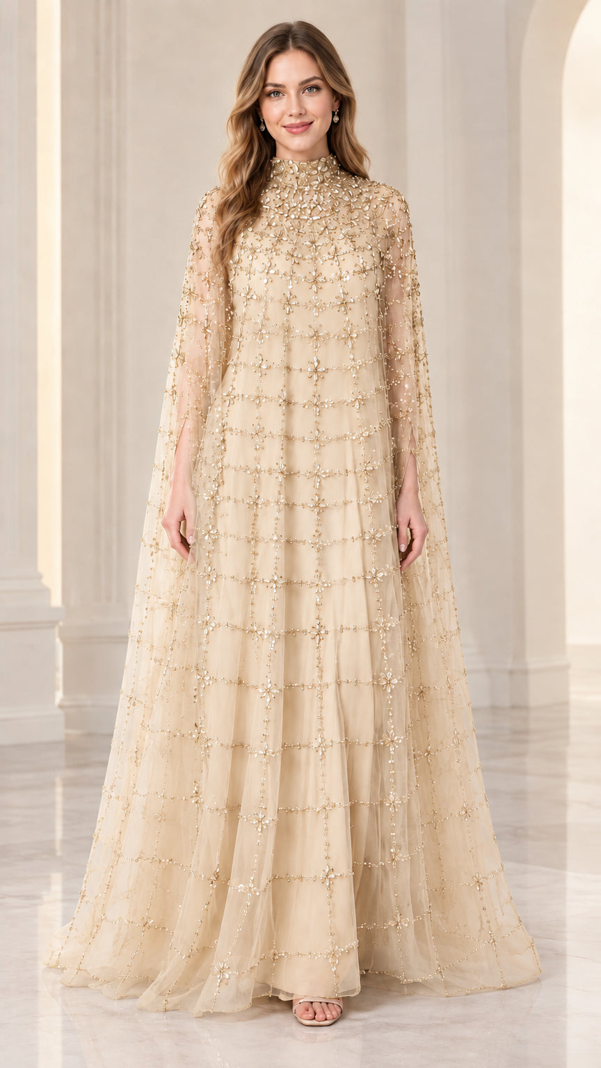 Front full view of woman wearing champagne beige beaded cape evening gown