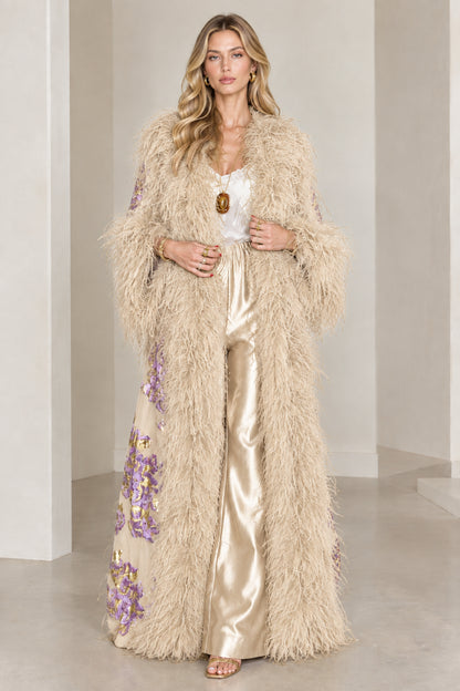 Full-length view of champagne beige floral brocade maxi coat with matching feather trim