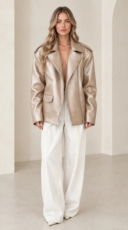 Front view of woman wearing oversized metallic gold faux leather biker jacket