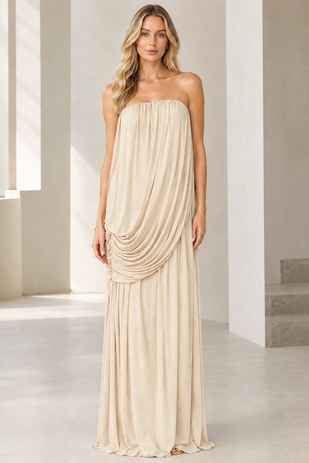 Front view of strapless draped cowl-front maxi dress in champagne