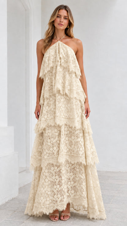 Full-length view of model wearing Champagne cream tiered lace halter gown
