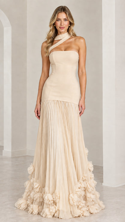 Model wearing the champagne beige asymmetric pleated drop-waist evening gown